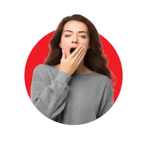 Young woman covering her mouth while yawning, showing signs of fatigue, low energy, and tiredness
