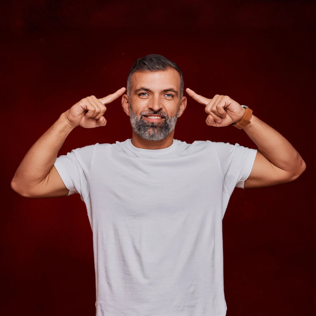 man pointing to head showing improved focus memory brain function