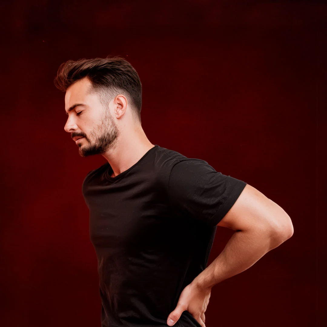 man holding lower back pain muscle soreness recovery shilajit benefits